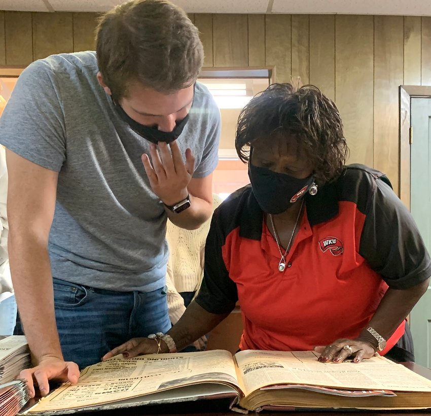 Matt Brown, a senior Political Science major enrolled in the Fleischaker-Greene First Amendment Reporting class in the School of Media at Western Kentucky University and Dr. Saundra Ardrey, a professor in the Political Science Department at WKU, read copies of the Neshoba County Democrat published during the 1964 Freedom Summer.
